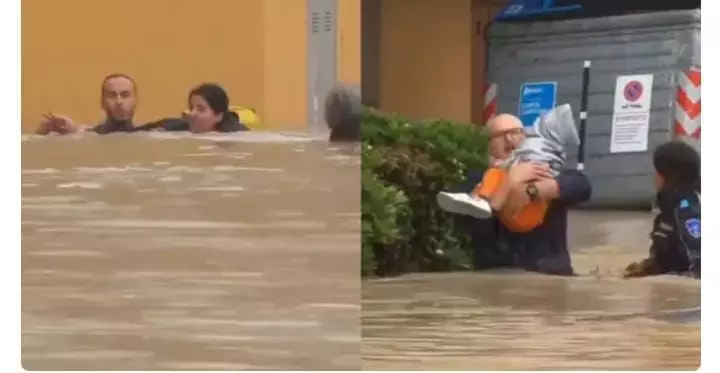 इटली में मां-बेटी को बचाने के लिए पड़ोसियों ने बढ़ते बाढ़ के पानी का बहादुरी से किया सामना